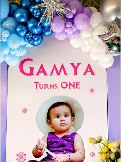 A personalized backdrop for the Frozen theme, featuring a photo of the birthday girl.