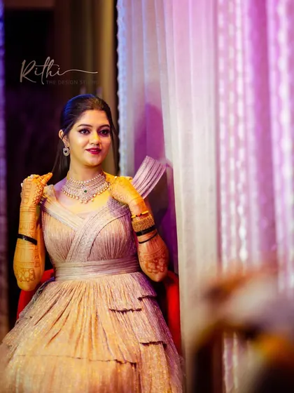 Another beautiful shot of Akshatha, showing the elegant structure and fit of her custom reception gown.
