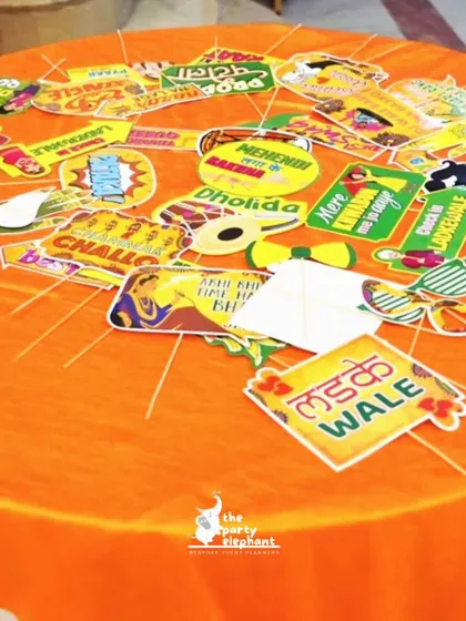 Fun, quirky photo props are a must for a Mehendi party. I provide a variety of signs with fun Hindi phrases like 'Ladke Wale' (Groom's Side) for guests to enjoy.