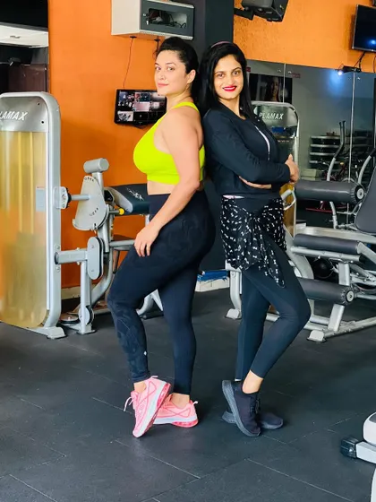Back-to-back and ready to train. A confident pose before we hit the weights.