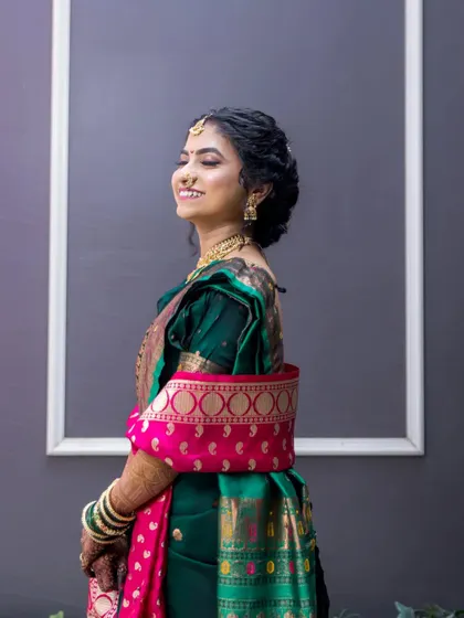 A profile portrait of the bride, her happy expression and elegant attire creating a timeless image.