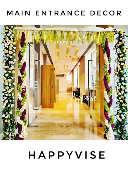 The celebration starts at the entrance. For this naming ceremony, I created a beautiful floral archway with braided garlands of fresh flowers to welcome guests into the venue.
