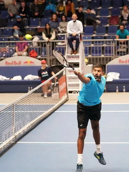 An overhead smash, an aggressive shot to finish the point.