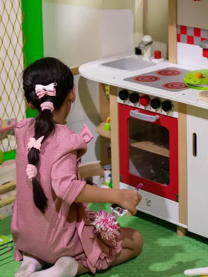 A closer look at the detailed play kitchen where kids can pretend to cook and bake for hours.