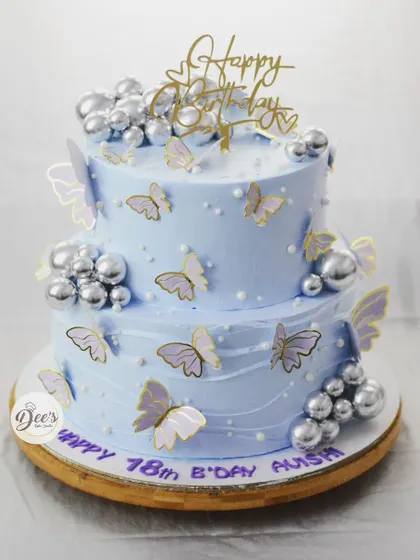 Another beautiful butterfly cake, this time in a cool blue hue with silver bubble accents and lilac butterflies for a sophisticated 18th birthday.