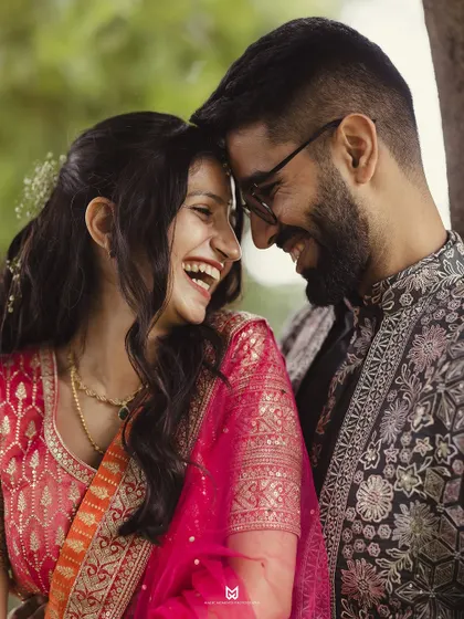 A beautiful close up shot focusing on the couple's laughter and connection. These are the authentic moments that make the best memories.
