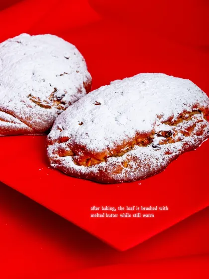 After baking, the Stollen is brushed with melted butter while still warm.