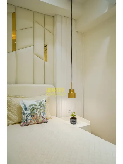 Another detail shot of the Tata LaVida master bedroom, focusing on the pendant light and the texture of the fluted wall panel next to the bed. Every element is chosen to contribute to a serene atmosphere.