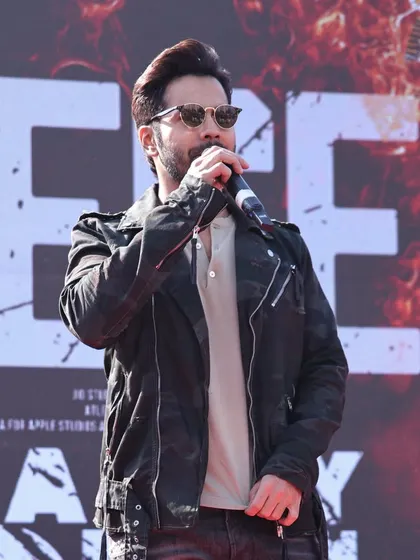 A close-up of Varun Dhawan addressing the audience at the 'Baby John' promotional event. This image reflects our ability to manage the technical aspects, like audio and staging, for celebrity speakers and performers.