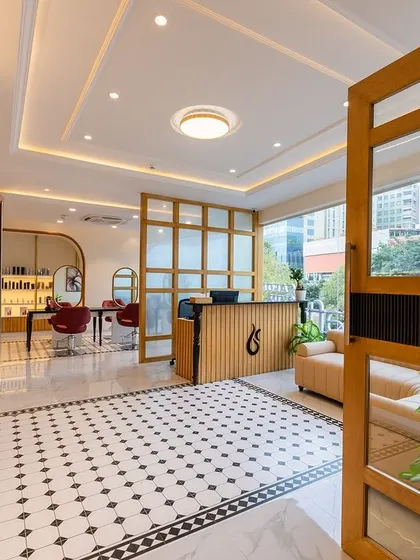Looking into our Yelahanka location from the entrance. The open layout with distinct zones for salon services and consultations ensures a seamless and organized experience for every client.
