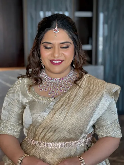 A beautiful candid shot of Likitha. The makeup was designed to look flawless both in person and in photographs.