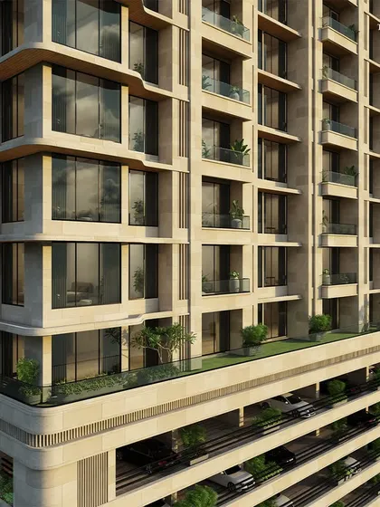 A detailed look at the facade, where the structured geometry is softened by the building's cylindrical motion. This contrast between symmetry and gentle curves lends the building its distinctive, balanced presence.