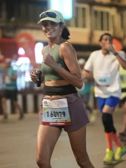 Running strong during the early hours of the Mumbai Marathon. My race prep focuses on pacing strategies to ensure you have energy for the entire distance.