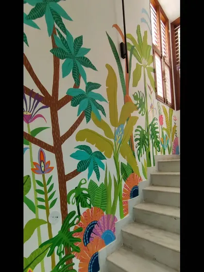 Another angle of the staircase mural, showing how the design flows up the wall and interacts with the architecture of the space.