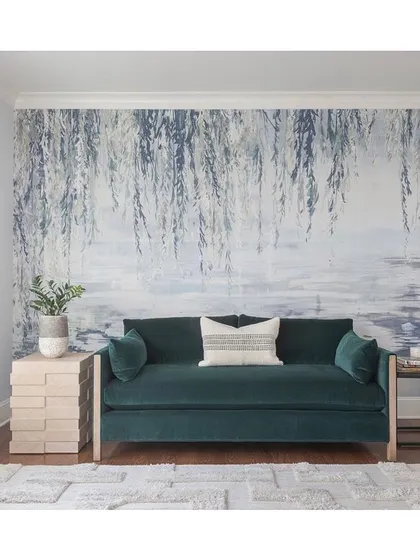A serene and tranquil atmosphere is achieved with this 'Serenity' collection wallpaper. The delicate willow branches create a soothing, painterly effect, ideal for creating a peaceful retreat in a living room or bedroom.