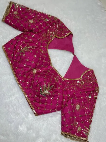 When your blouse speaks louder than your lehenga. This is pink power and handcrafted glory.