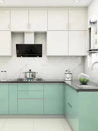 A simple and clean L-shaped kitchen with mint green and white cabinets. This design is perfect for homeowners who want a touch of color without overwhelming the space.
