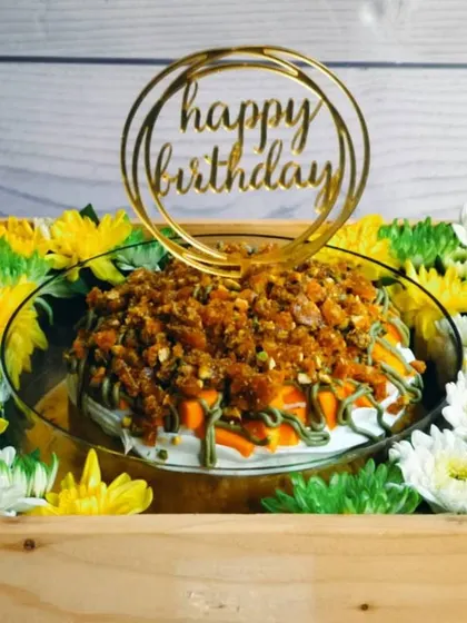The vibrant colors of the Mango Pistachio Tres Leches Hamper are on full display here. The yellow and green flowers perfectly complement the mango and pistachio flavors of the cake.