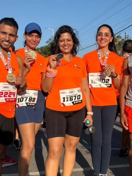 Medals earned, not given. Our runners proudly displaying their finisher medals after the Honda Manesar Half Marathon.