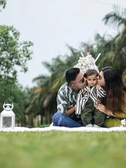 A heartwarming family moment during an outdoor photoshoot. Our picnic setup provides a comfortable and beautiful space for families to interact naturally for the camera.
