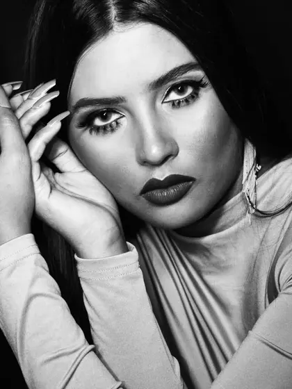 A powerful black and white portrait. For this type of photography, I focus on contrast, creating depth with contouring and defining the eyes and lips to stand out in a monochromatic format.