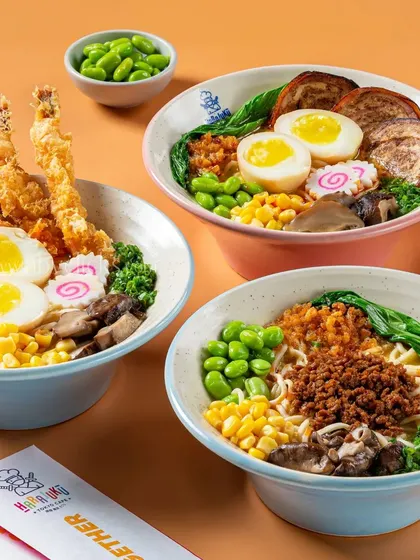 An assortment of ramen bowls, including shrimp tempura and minced chicken, showcasing a variety of options.