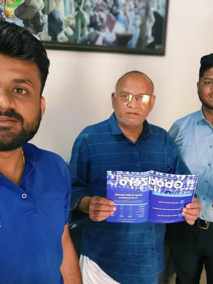 Our team presenting a solar information packet to a new customer. We ensure our clients have all the information they need.