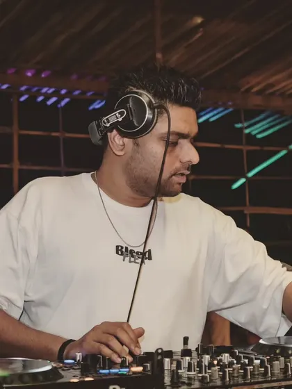 A focused shot of me at the console during a Friday night set. My playlist for these events includes a wide range from Hip Hop and R&B to Bollywood and Punjabi pop.