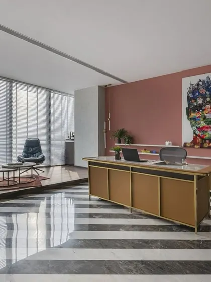 This 3,500 sq. ft. CEO office, located on the 35th floor in Mumbai, offers an incredible sea view and exudes both luxury and functionality. The striking diagonal stripes on the floor and the curated, private layout create a powerful environment for a leading petrochemical company.