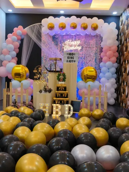 This angle shows the full effect of the balloon-filled floor and the shimmering backdrop. It’s a great example of how I can transform the space into a unique party room.