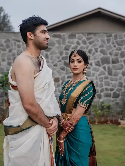 A classic portrait of the bride and groom in their traditional South Indian wedding attire. We ensure you get those timeless shots that beautifully represent your heritage and your union.
