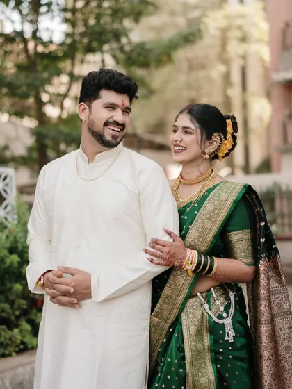 The beauty of a shared smile. This candid shot captures the couple's natural chemistry during their traditional pre-wedding photoshoot.