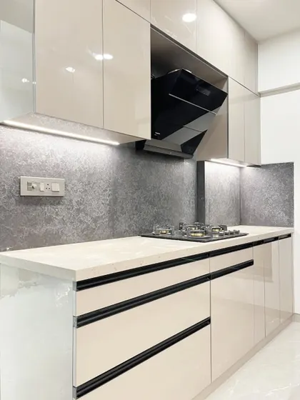 Another view of the hob and chimney, with under-cabinet lighting providing excellent task illumination.