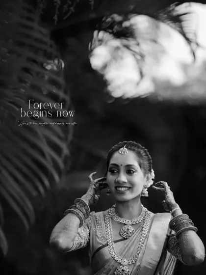 'Forever begins now'. A timeless black and white portrait of the bride, capturing a moment of happy anticipation.