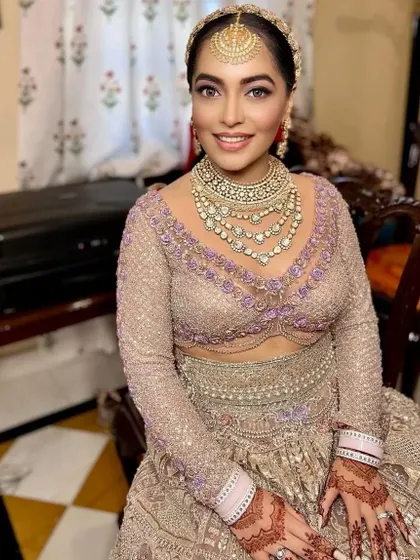 A beautiful bride ready for her big day. The mehendi on her hands is a key element of her complete bridal look.