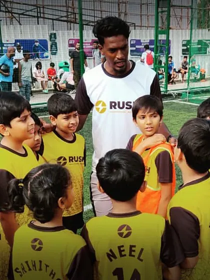 A coach gives a team talk to our U7 and U9 players during Week 2 of the Karnataka Youth League. These moments are crucial for learning and motivation.
