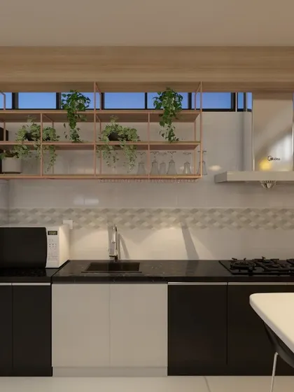 The pantry and breakout area of an office, designed to be a refreshing space for employees. It features open shelving with greenery, a high table for quick meals, and motivational wall art.