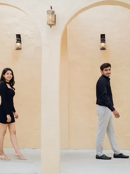 Sometimes, simplicity is the most elegant. For this couple's photoshoot, we used a minimalist arched hallway to create a clean, modern, and sophisticated look. This style is perfect for capturing candid, natural interactions.