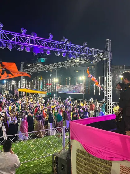 A wide shot of the massive crowd and stage setup for Navratri.