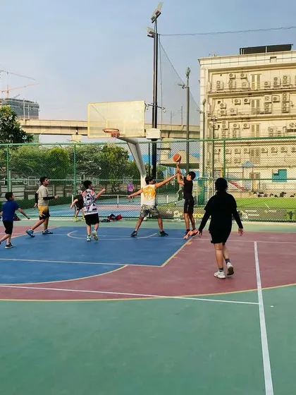 A wide view of our evening session, with multiple players engaged in a full-court game.
