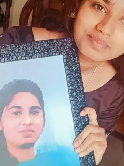 A happy client holding her framed digital painting. While created digitally, I use painting techniques to give it a soft, blended look, and offer framing to provide a complete service.