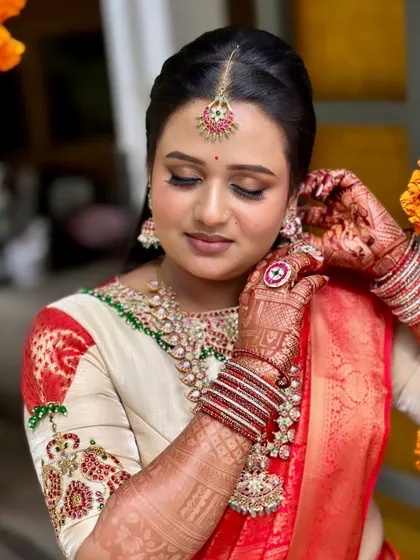 A close-up of Bhavya's makeup. The focus is on creating a flawless base and enhancing her beautiful features.