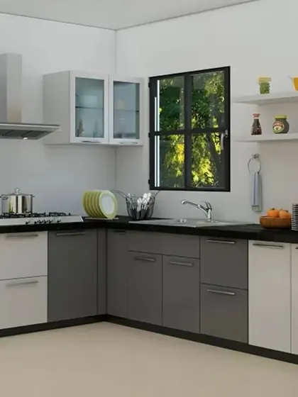 A practical L-shaped kitchen in a two-tone grey and white finish. The design includes open shelving and frosted glass cabinets, adding visual interest and breaking up the solid blocks of color.