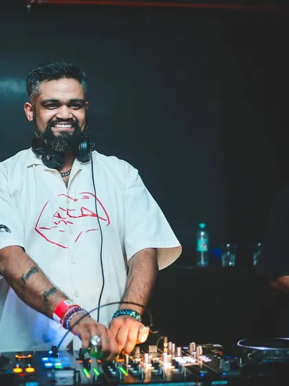 A smiling shot from behind the decks, ready for a big Christmas weekend of gigs.