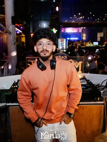 A casual shot of me at the DJ booth at Cafe Mambo. Even during the most intense parties, I maintain a calm and focused presence.