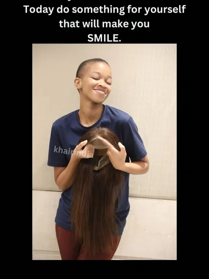 A smile that says it all. This image captures the pure happiness of a client receiving her new full wig, a moment of renewed confidence and self-love.