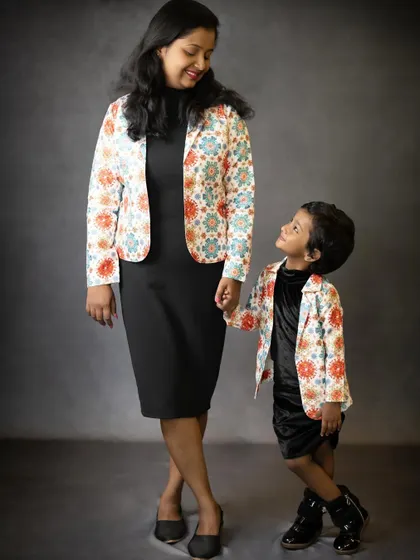 A stylish mother-daughter duo in matching jackets. We love helping families coordinate outfits to create fun and memorable themed photoshoots.