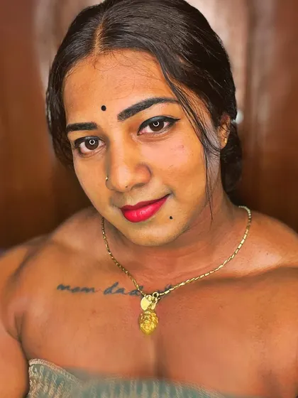 A direct, confident look. This image captures my approachable yet fierce persona, with the focus on my strong upper body and expressive face.
