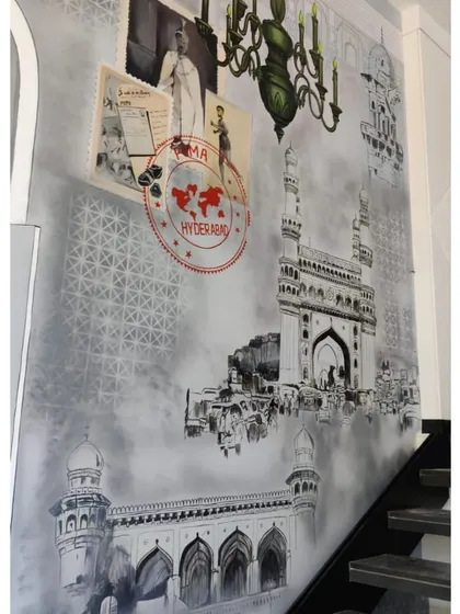 A detailed view of the collage elements in the Puma mural, including vintage-style posters, a Hyderabad postal stamp, and sketches of local landmarks.