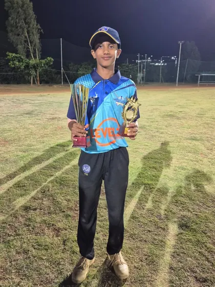 Our player holding his trophies for Best Bowler and team champion at the U-14 Kreeda Macushla Cricket Carnival.